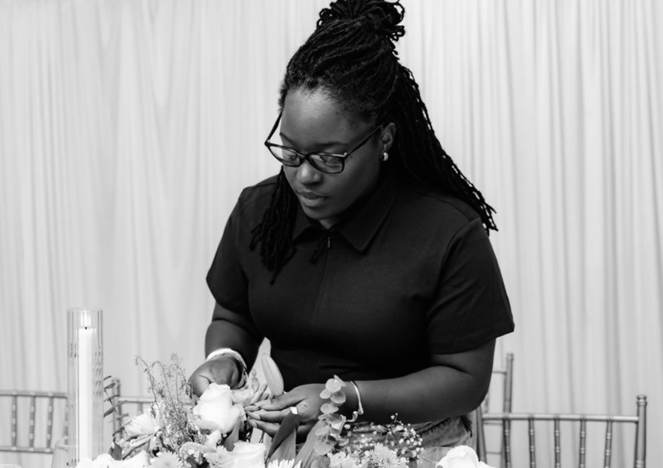 Tea Irkliewskij arranging florals at an event